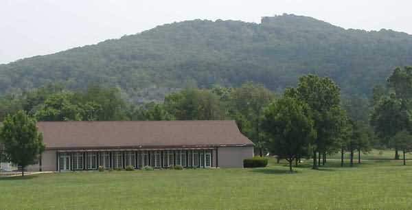 A photo of Pilot Knob with the Battlefield museum in the foreground